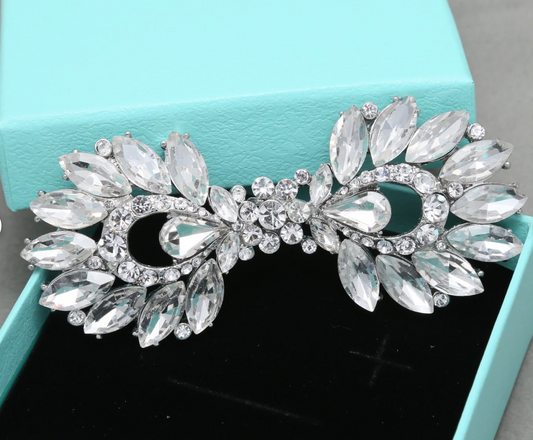 Elegant rhinestone hook and eye button ideal for wedding dresses and special occasion costumes.
